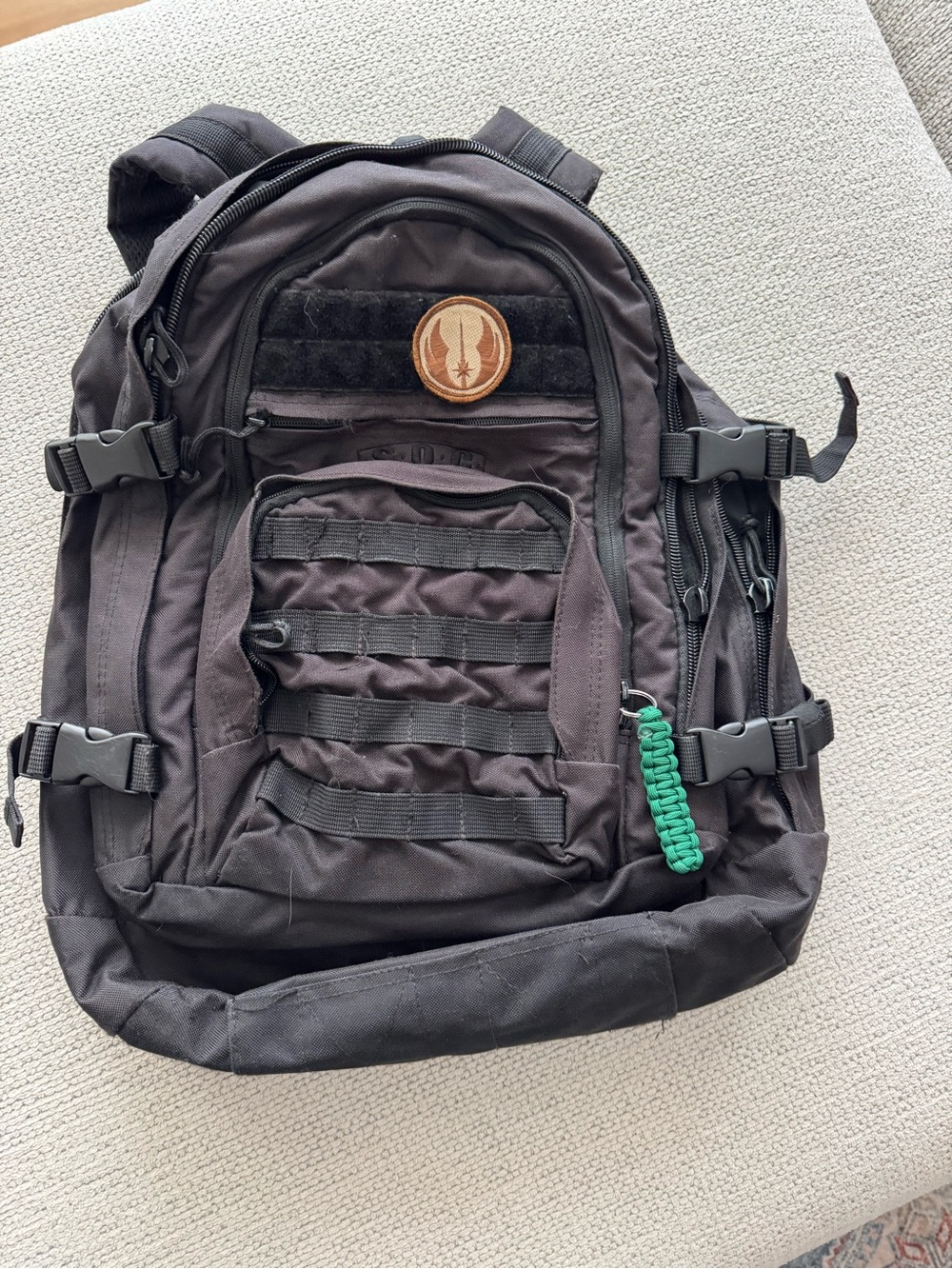 Black Tactical Backpack with Green Paracord Accent